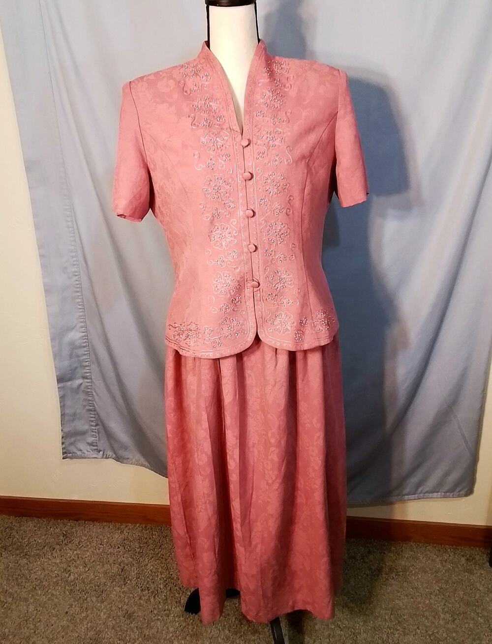 Karen Stevens Rose colored dress